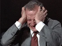 A six-panel image sequence shows a man in a gray suit and red tie progressively reacting with increasing distress, starting…