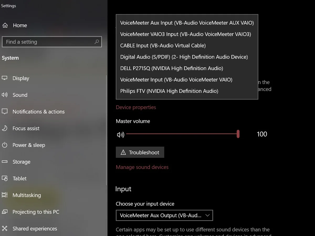 A screenshot of Windows Settings > Sound showing a dropdown menu with multiple audio input devices, including VoiceMeeter…