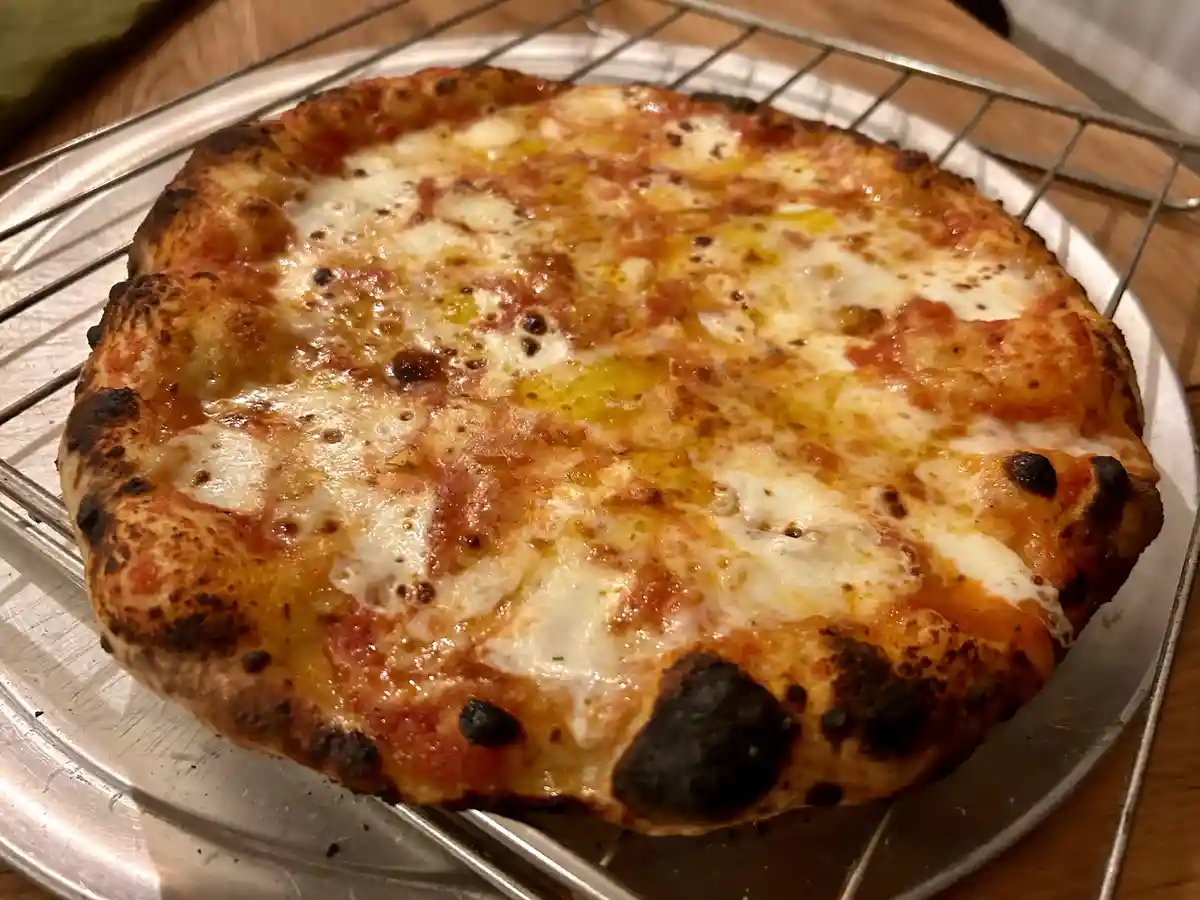 Hey Italians, is this a thing? Reheating pizza and topping it with mortadella the next day?