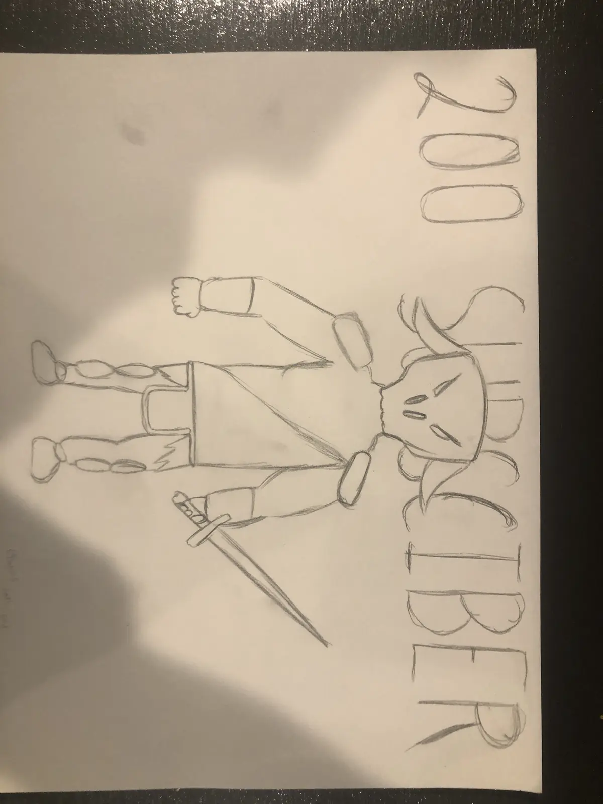 A hand-drawn pencil sketch on paper shows a stylized cartoon character with a determined face, wearing a cape and holding a…