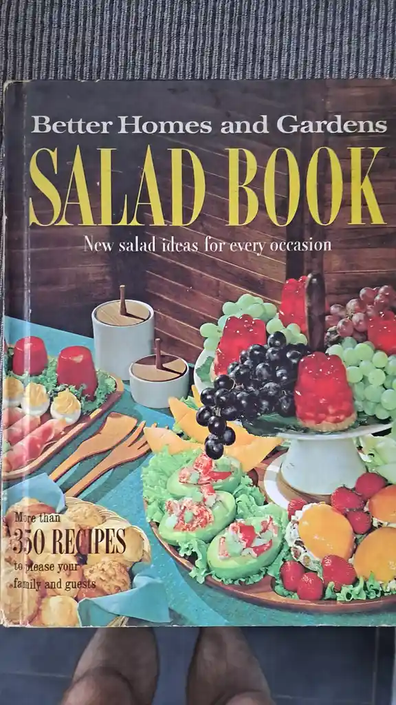 A vintage Better Homes and Gardens Salad Book cover featuring a colorful spread of retro salads, including avocado boats…