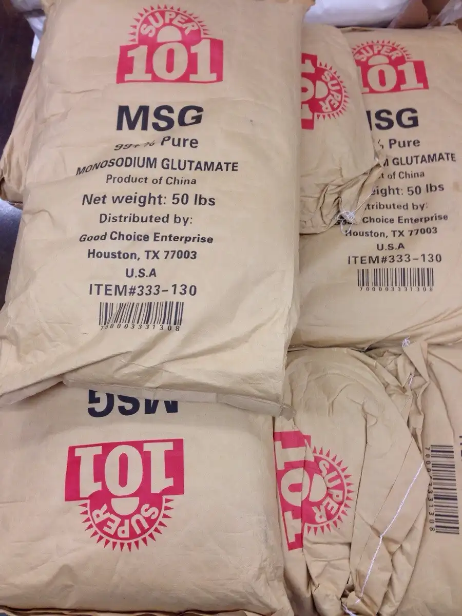 The image shows several large, beige paper sacks stacked together, each labeled with red and black text. The prominent red…