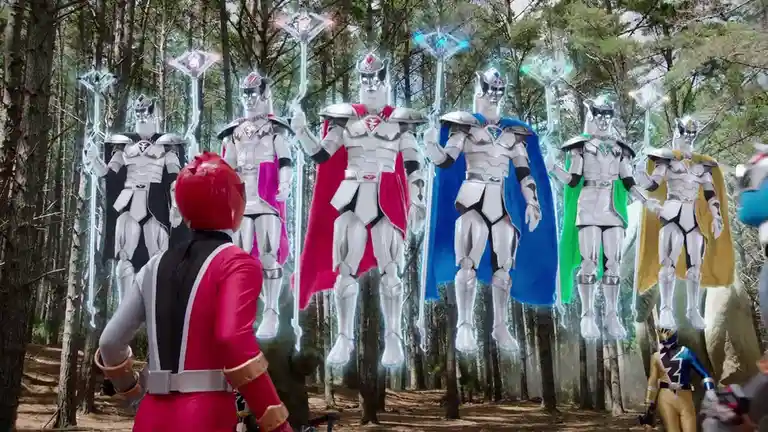 A red Power Ranger stands with his back to the viewer in a forest, facing six floating, armored, silver-skinned figures with…