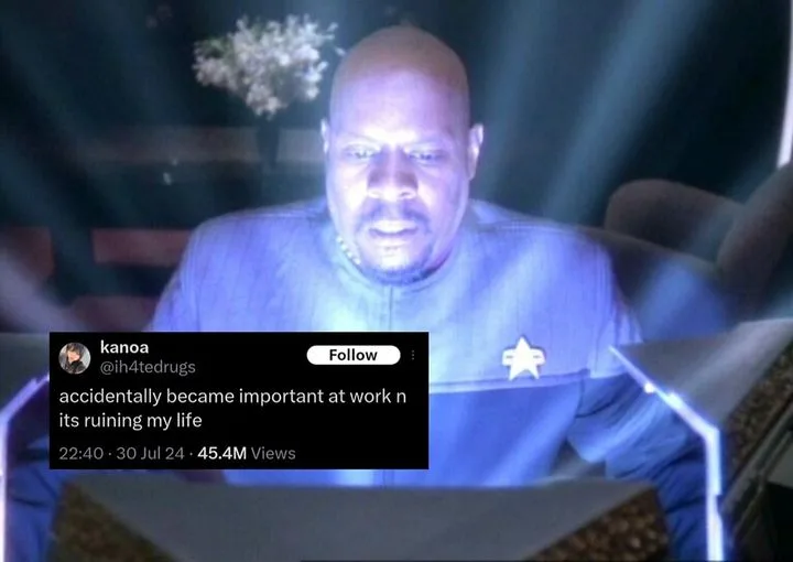 A screenshot of a Star Trek: The Next Generation scene featuring a bald Black man in a blue uniform with a star insignia…