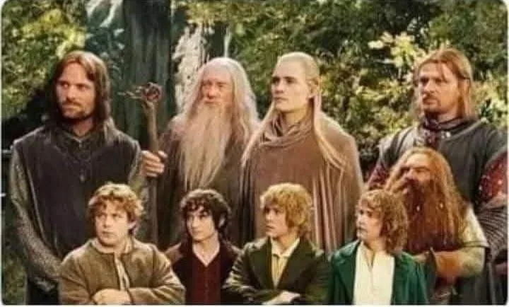 A group of nine characters from 'The Lord of the Rings' movie, including Gandalf, Aragorn, Legolas, Gimli, and the four…