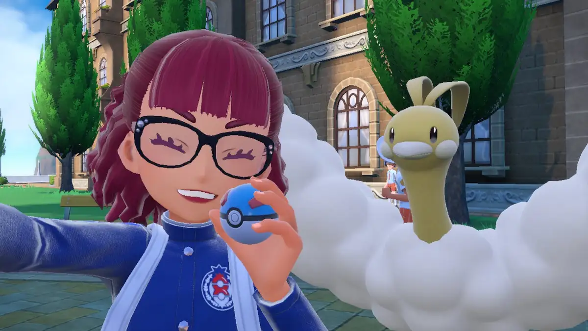 A character from the Pokémon video game series, with maroon hair and glasses, holds a Poké Ball while taking a selfie…