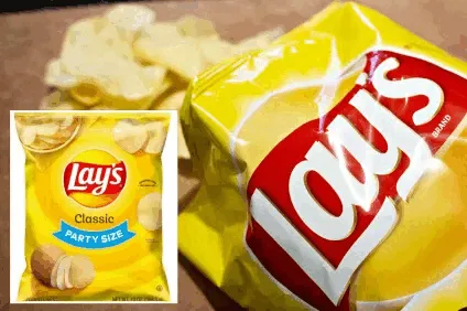 A large, open bag of Lay's Classic potato chips is shown with scattered chips around it. In the bottom left corner, a…