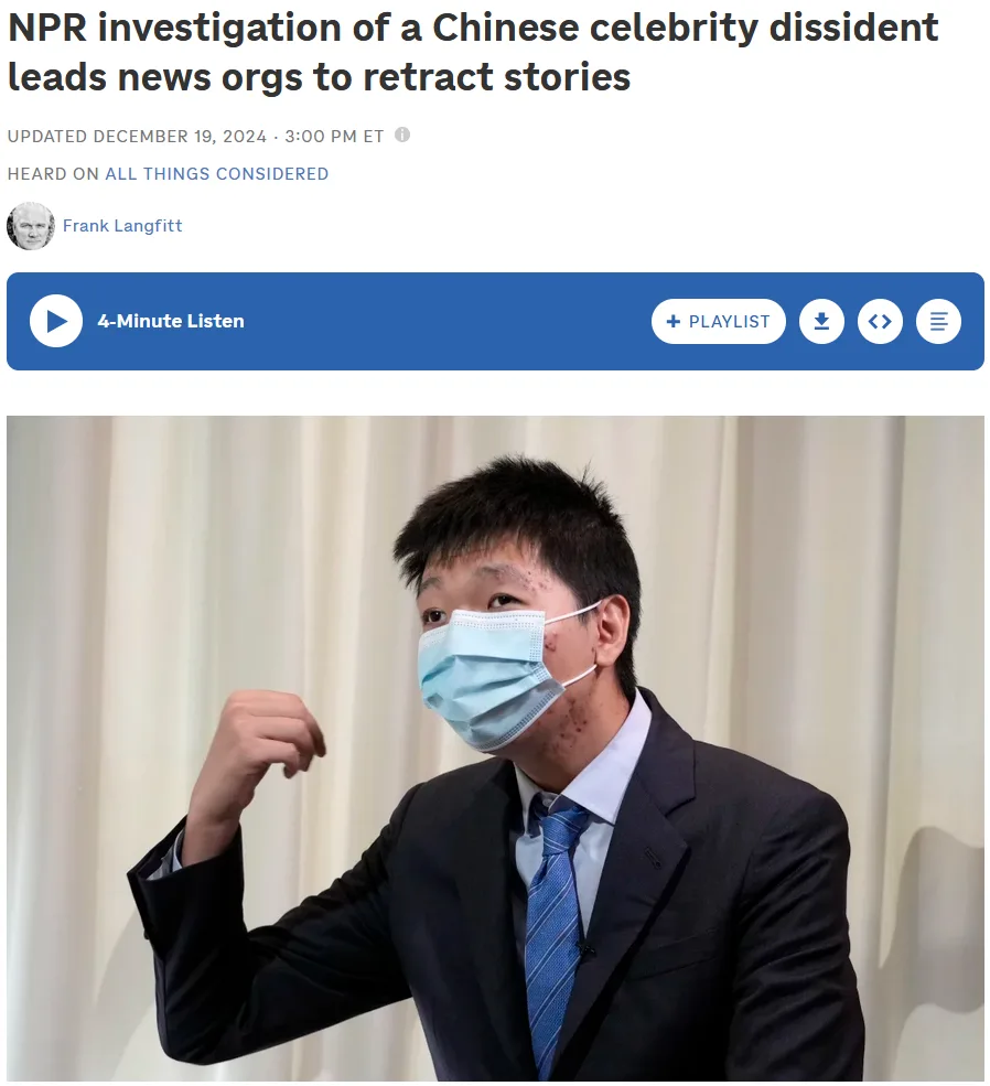 A man in a dark suit and blue tie wears a light blue surgical mask pulled down to his chin, flexing his right bicep while…