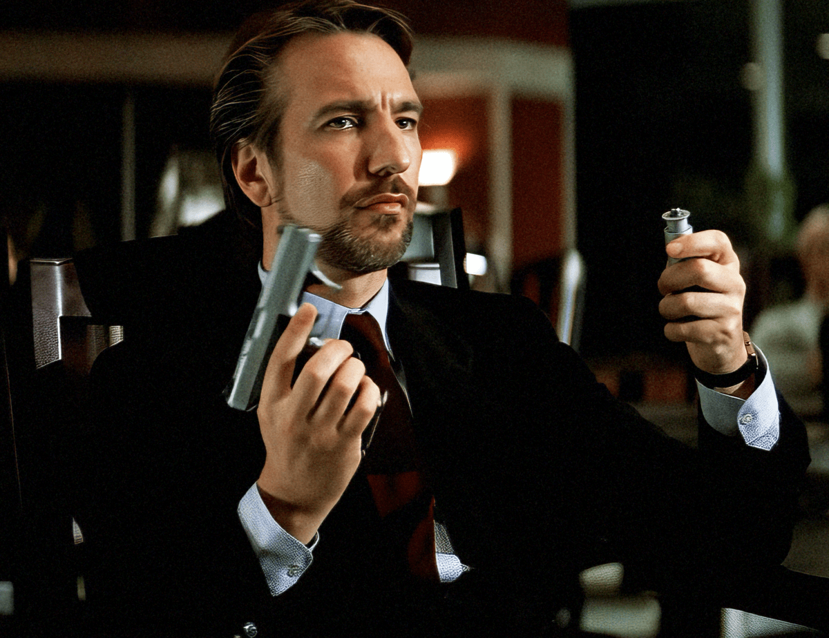 A six-panel image sequence shows actor Nicolas Cage in a dark suit holding a handgun, progressing from examining the gun to…