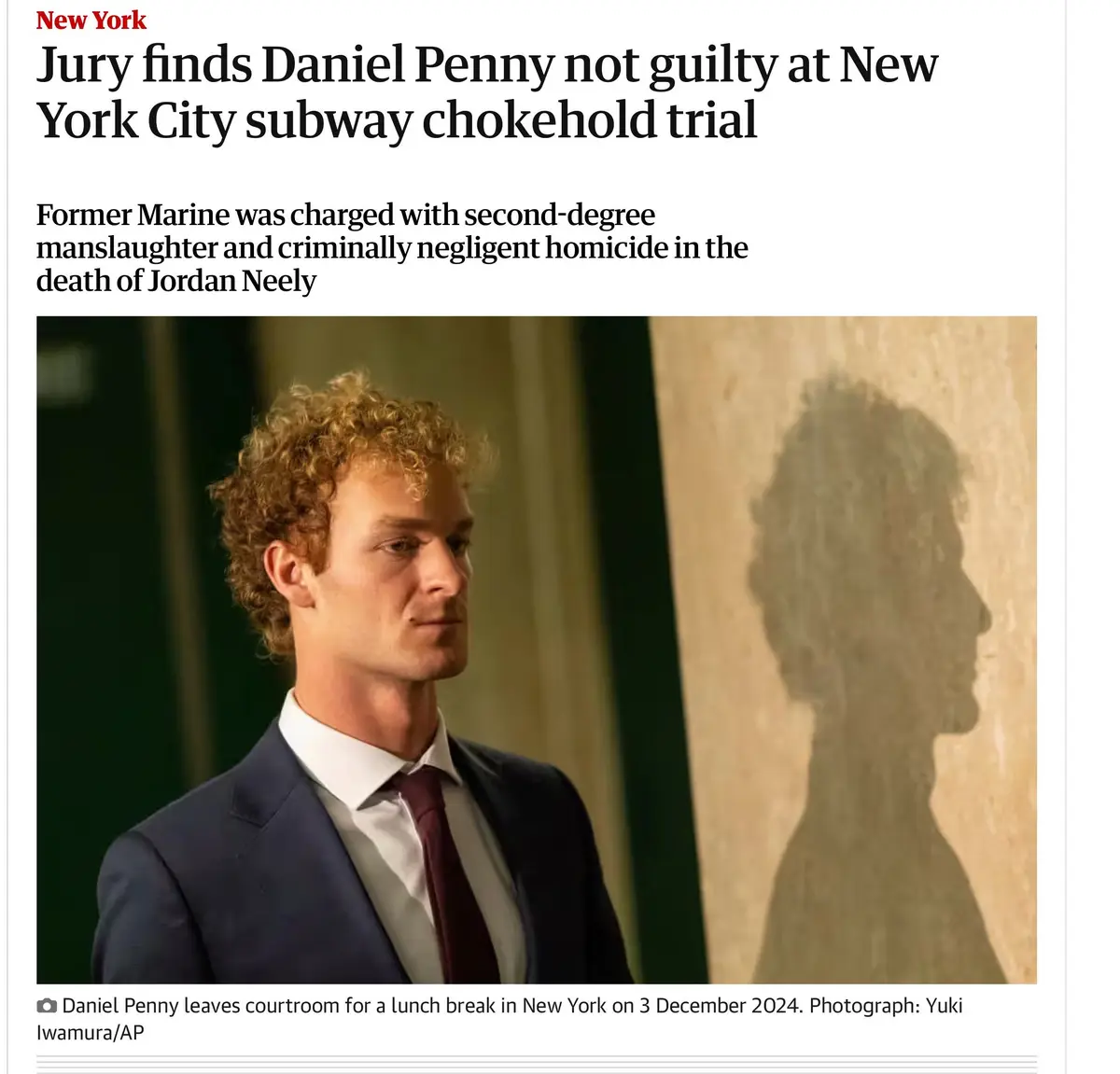 A newspaper clipping shows Daniel Penny, a man with curly blonde hair in a suit and tie, looking off to the side with a calm…