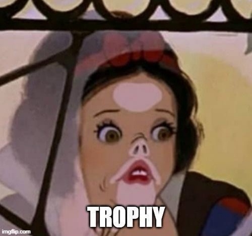 A close-up of Snow White from Disney's animated film, showing her with wide, shocked eyes and a pale, startled expression…