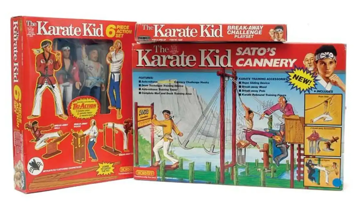 Three vintage toy boxes for 'The Karate Kid' are displayed, featuring action figures and playsets. The largest box, 'Sato's…