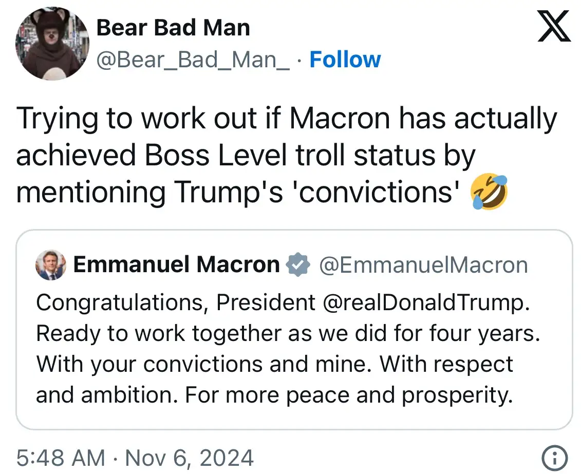 A screenshot of a Twitter/X post by 'Bear Bad Man' showing a reply from Emmanuel Macron's official account. Macron's tweet…