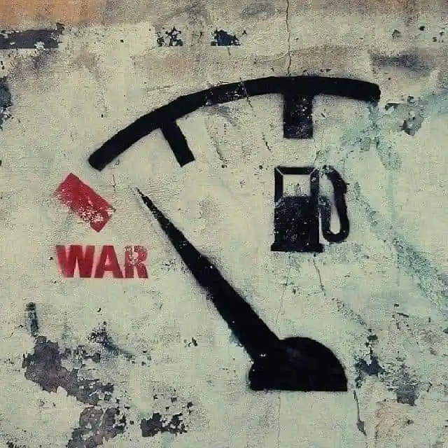 A weathered, textured image shows a stylized fuel gauge with the needle pointing toward the 'E' (empty) mark. The word 'WAR'…