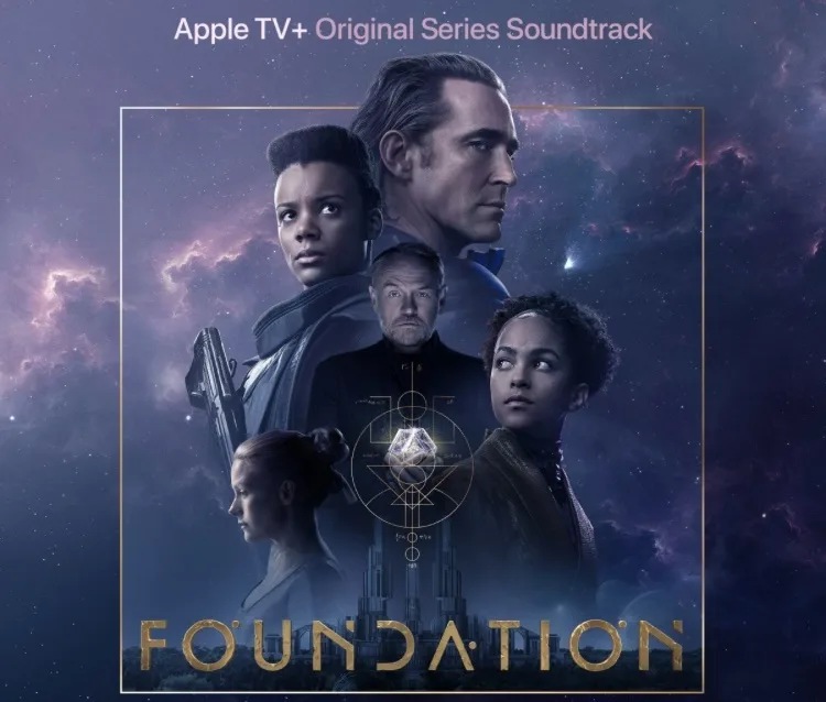The image is a promotional poster for the Apple TV+ series 'Foundation,' featuring six main characters against a cosmic…
