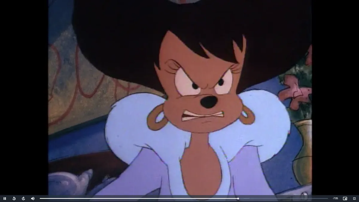 A close-up of the animated character Lady Blue, a brown dog with a large afro hairstyle, wearing a purple outfit with a…
