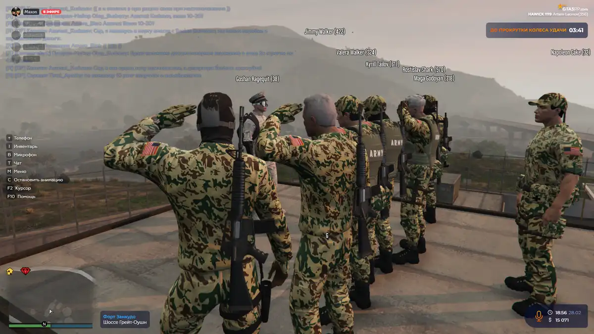 A screenshot from GTA V multiplayer shows a group of soldiers in camouflage uniforms saluting on a rooftop. One soldier…