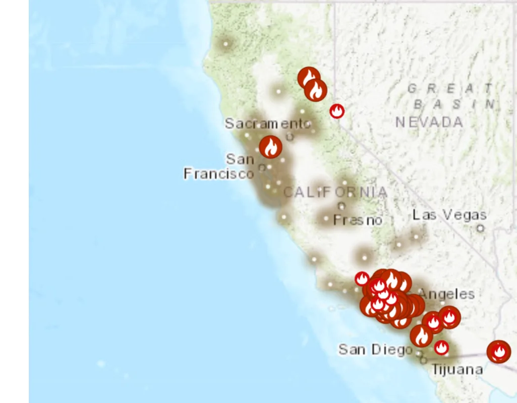 a map of california and parts of the southwest shows numerous red flame icons marking wildfire locations, with a dense…