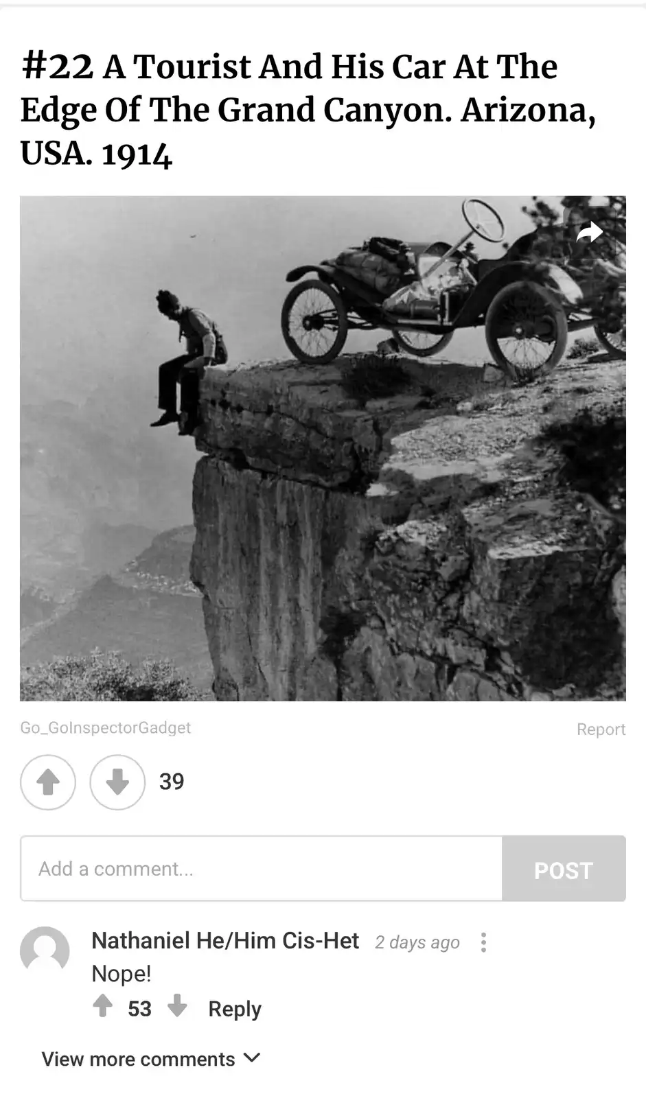 A black-and-white historical photo from 1914 shows a man sitting precariously on the edge of a cliff overlooking the Grand…