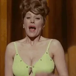 A six-panel sequence shows a woman in a bright green bra reacting to something shocking: she starts with her mouth wide open…