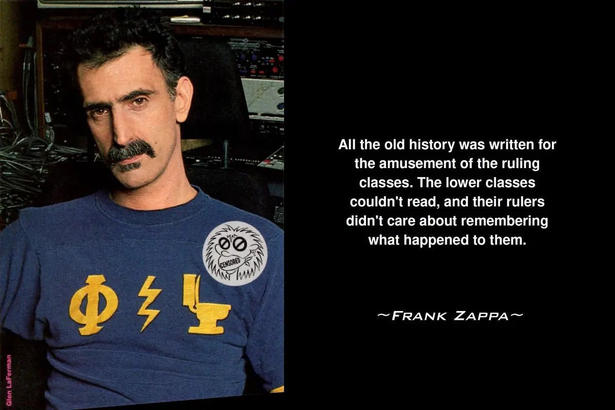 A photograph of Frank Zappa wearing a blue t-shirt with yellow symbols and a 'CENSORED' patch, set against a backdrop of…