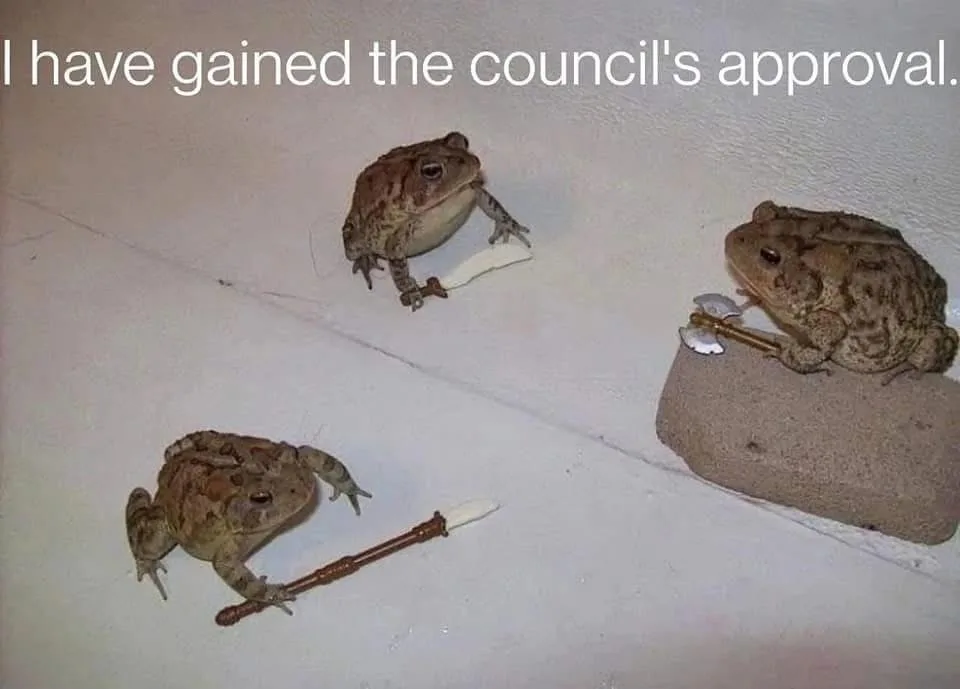 Three toads are shown on a white wall or floor, each holding a small toy weapon: one holds a sword, another a pickaxe, and…