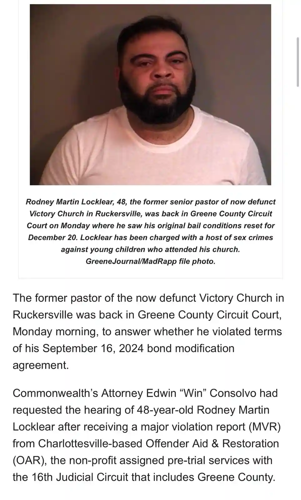 A mugshot-style photo of a man with a beard and short hair wearing a white t-shirt. Below the photo, a news caption…