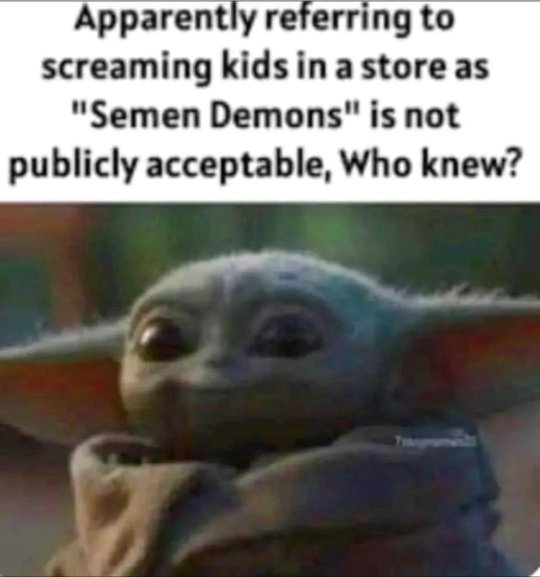The image shows a close-up of Grogu (Baby Yoda) with a confused, slightly bewildered facial expression. He is wrapped in a…