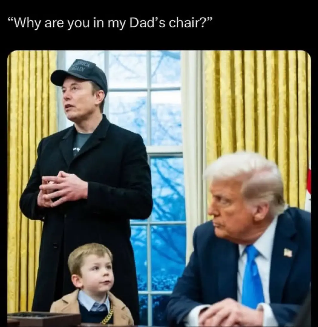 A photo shows Elon Musk standing in what appears to be the Oval Office, wearing a black cap and coat, with a young boy in a…