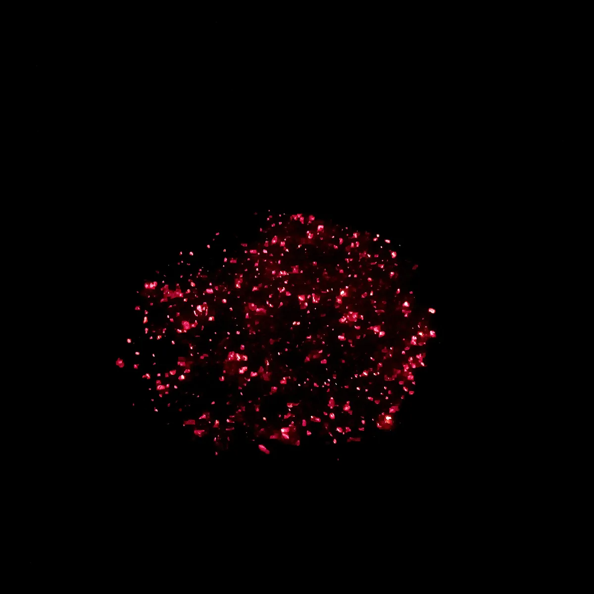 A black background with a cluster of bright pink glitter-like particles in the center. The text 'i'm not crying, you're…