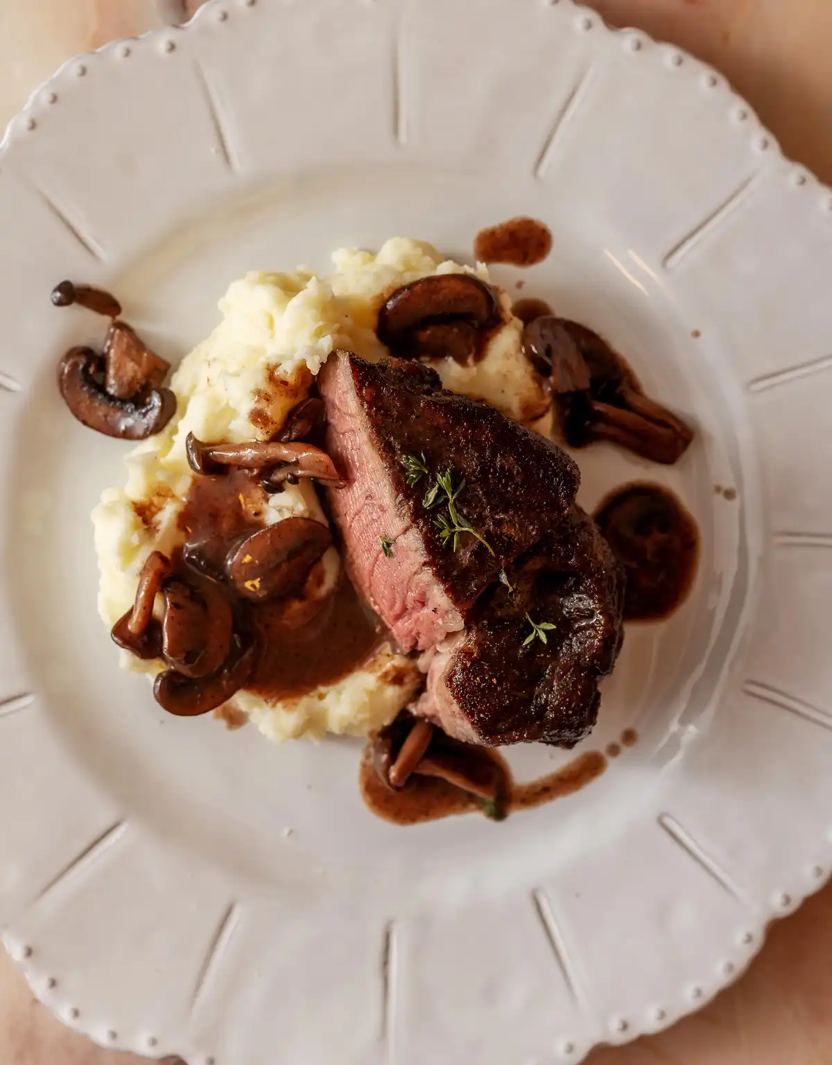 Indulge in filet mignon drizzled with rich red wine mushroom sauce!