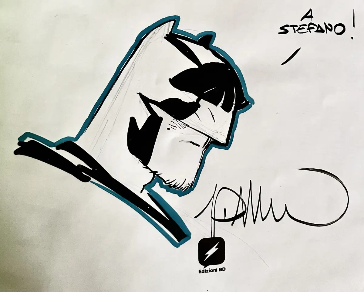 A hand-drawn, stylized illustration of a man's face in profile, outlined in teal with black ink, appears to be emerging from…