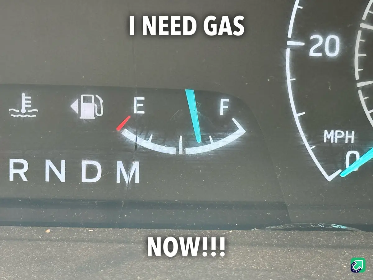 A close-up of a car's dashboard shows the fuel gauge needle hovering just above the 'E' (empty) mark, with the overlaid text…