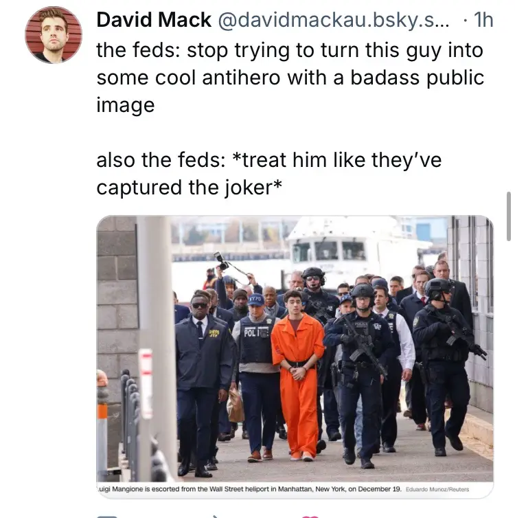 A photo shows Luigi Mangione, in an orange jumpsuit, being escorted by heavily armed police officers. The overlaid text…
