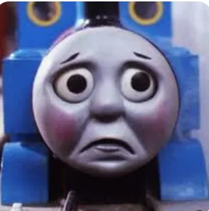 A close-up of Thomas the Tank Engine's face showing wide, teary eyes and a downturned mouth, conveying extreme sadness or…