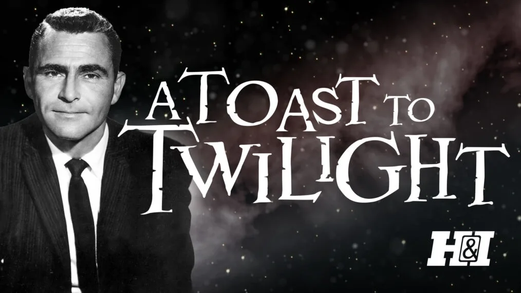 A black-and-white image features a man in a suit and tie against a starry, smoky background. Large, stylized white text…