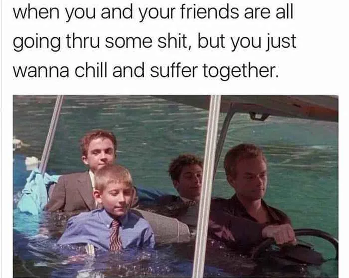 A still from the movie 'The Truman Show' shows four men in a small boat partially submerged in water, with one man driving…