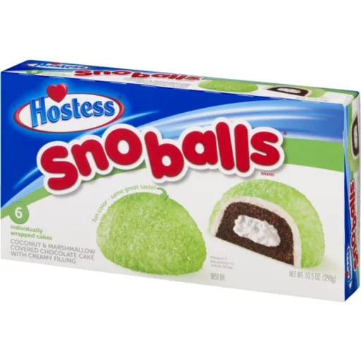 A product box for Hostess Snoballs, a snack cake with a green coconut coating, chocolate cake layer, and creamy marshmallow…