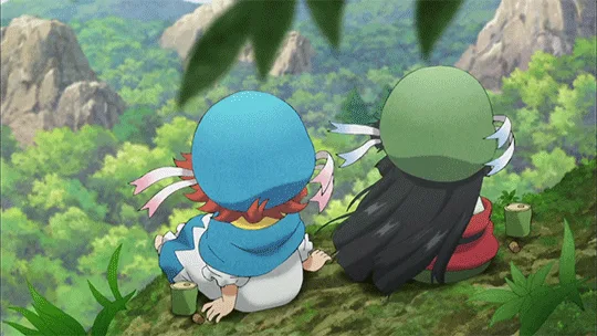 The image shows two anime-style characters sitting side-by-side on a grassy hill overlooking a forested valley with rocky…