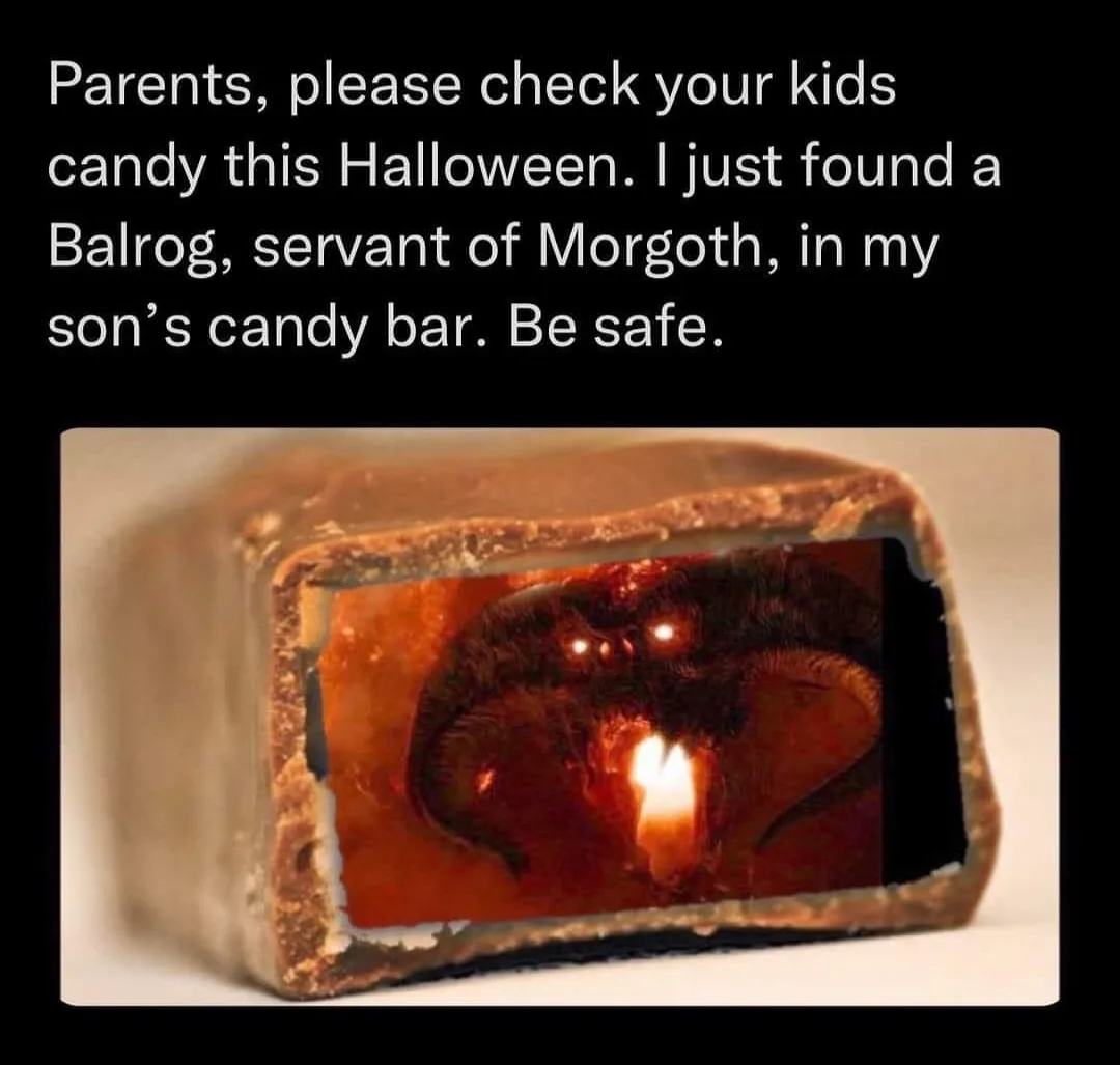A chocolate candy bar is sliced open to reveal a terrifying, fiery Balrog from Middle-earth, complete with glowing eyes and…