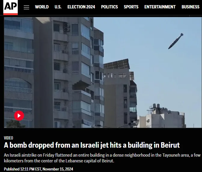 A screenshot of an AP News video thumbnail shows a bomb mid-air flying toward a tall apartment building in Beirut. The…