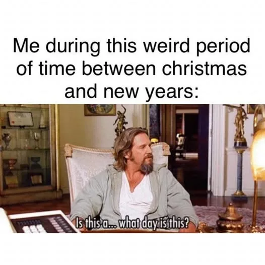 A man with long hair and a beard sits slumped in a chair in a luxurious room, looking confused and disoriented. He is…