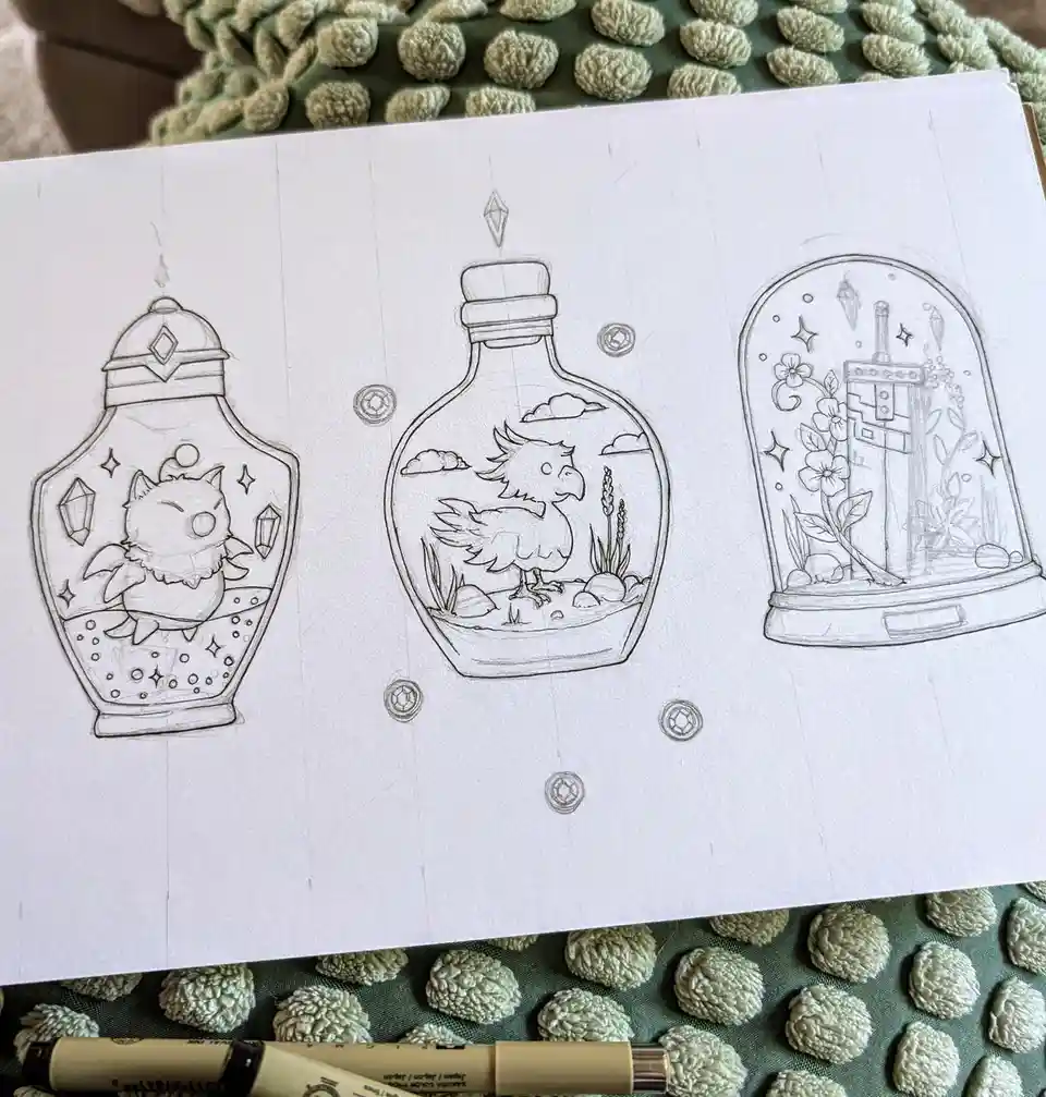 A pencil sketch on paper shows three whimsical fantasy-themed items: a potion bottle with a small creature, a bottle with a…