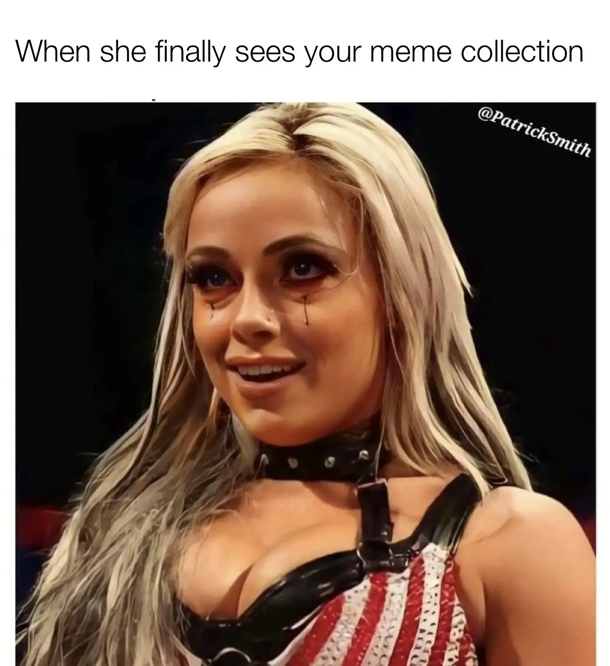 A woman with long blonde hair, blue eyes, and tears streaming down her cheeks while smiling, wearing a black leather choker…