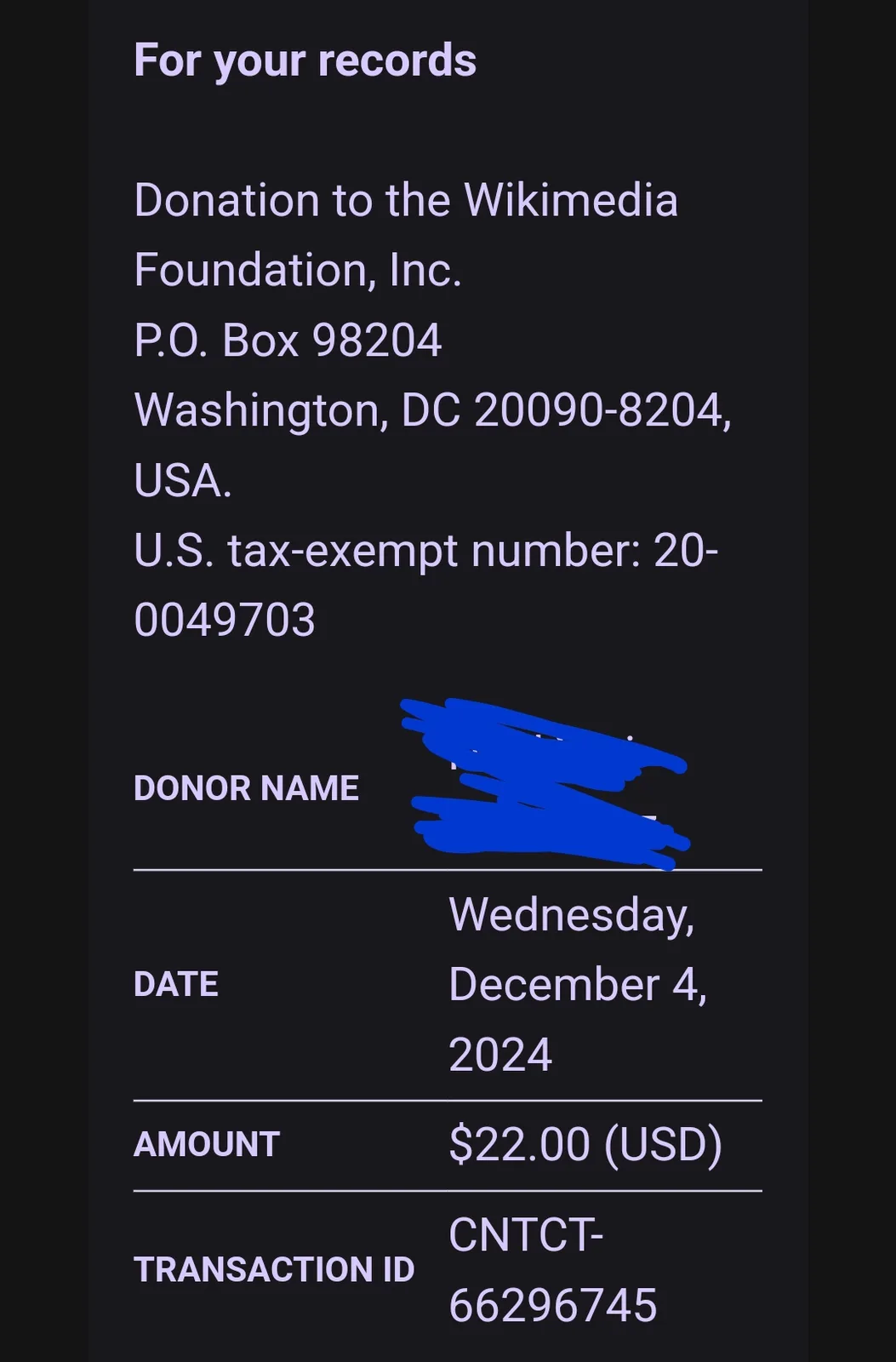 A screenshot of a donation receipt from the Wikimedia Foundation, showing the donor's name redacted with blue scribbles, a…
