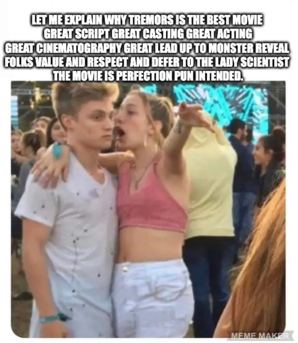 A young woman in a pink crop top and white pants is yelling passionately at a young man in a white t-shirt while pointing at…