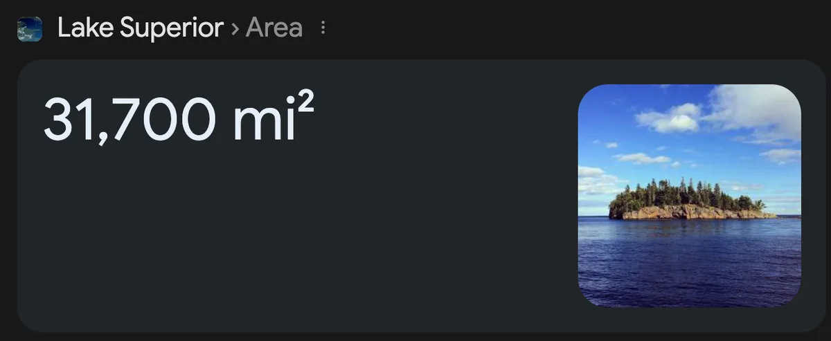 A screenshot of a digital interface showing 'Lake Superior > Area' with the value '31,700 mi²' displayed prominently next to…