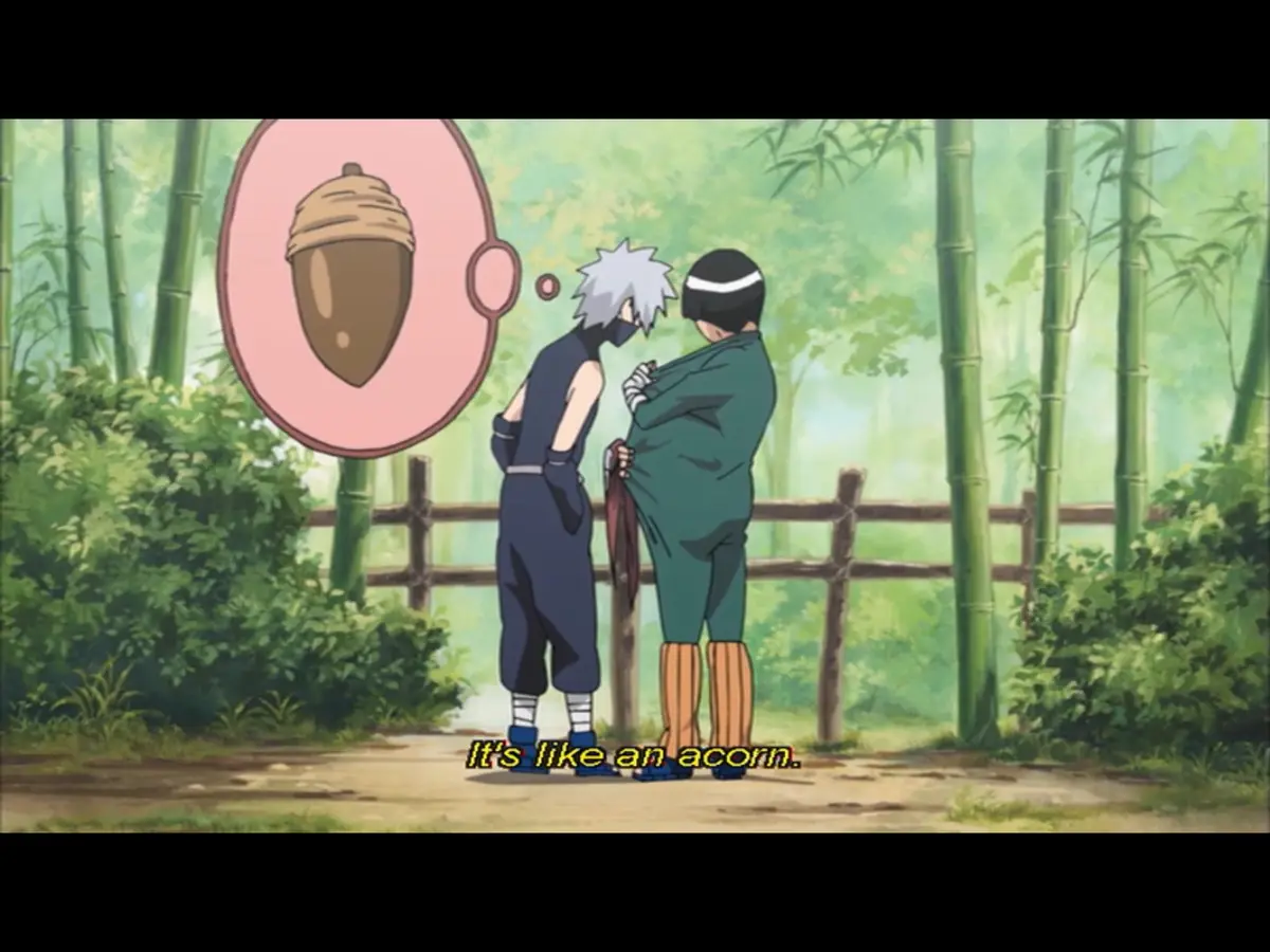 Two anime characters stand facing each other in a bamboo forest, with a thought bubble above one character showing an acorn…