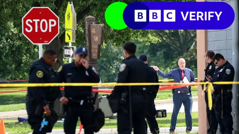 A photo shows police officers and a man in a blue shirt standing near a 'STOP' sign and a 'SORE PARK' sign, surrounded by…