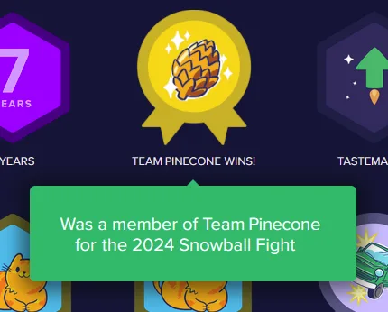 A digital badge screen shows a gold medal with a pinecone icon and the text 'TEAM PINECONE WINS!' below it. A green tooltip…